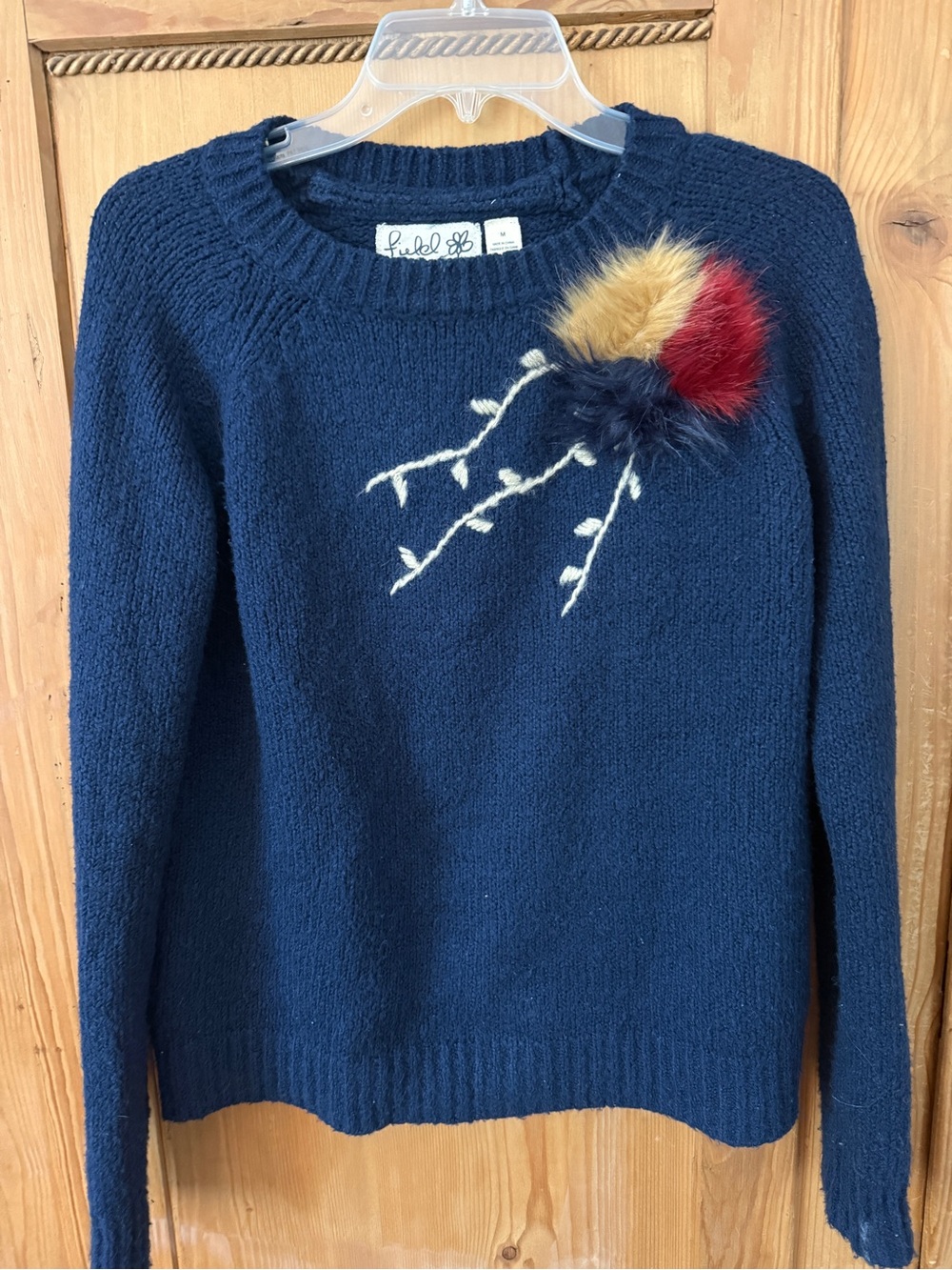 Anthropologie Field Flower Navy Blue Sweater with Red and Gold Pom Accent